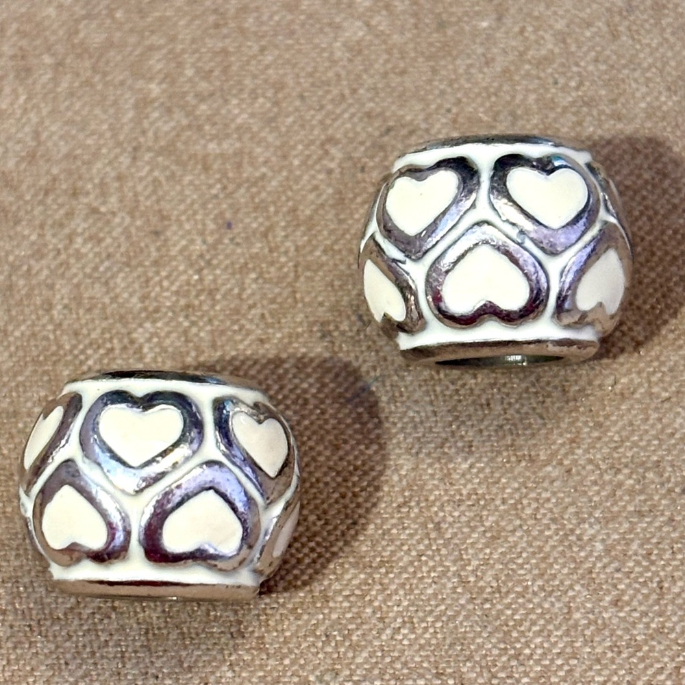 Two Brighton Open Heart beads in White Silver heart outlines on Enamel Retired